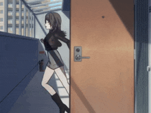 a girl is standing in front of a door that has the letter a on it