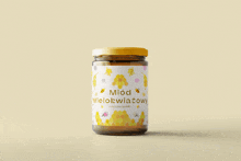 a jar of honey with a label that says miód z malina