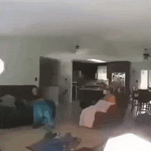a living room with a couch , chair , table and a kitchen .