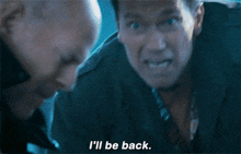 arnold schwarzenegger says " i 'll be back " while looking at another man
