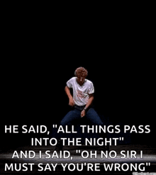a man in a white shirt is dancing on a stage with a quote .