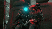 a robot with a blue light on its head has the number 28 on its arm