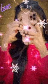 a girl taking a picture of herself with hearts and snowflakes around her