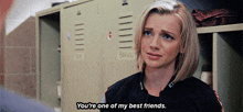 a woman says " you 're one of my best friends " in a locker room