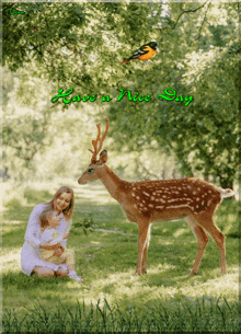 a picture of a woman holding a child and a deer with the words have a nice day below it