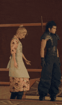 a man and a woman are dancing in front of a sign that says ' o ' sa ' on it
