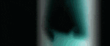 a close up of a person 's face in a dark room