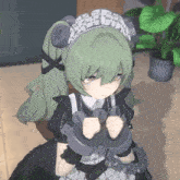 a girl with green hair is wearing handcuffs and a maid outfit