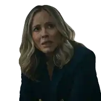 a woman with blonde hair is wearing a blue jacket and making a surprised face
