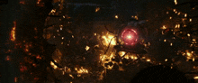 a large object with a red light coming out of it is on fire