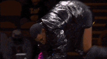a man in a wrestling ring with a belt that says world heavyweight championship