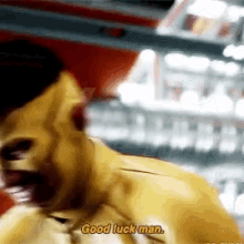 a man in a yellow jacket is screaming and says good luck man