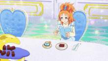 a girl sitting at a table with a heart shaped chair