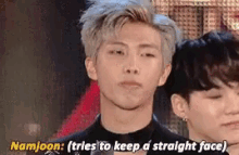 a close up of a man 's face with the words `` namjoon : ( tries to keep a straight face ) ''
