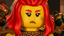 a close up of a lego character with red hair and an angry face