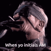 a man wearing a mask is smoking a cigarette with the words when yo initials am below him