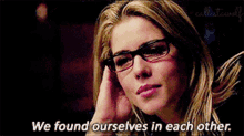 a close up of a woman wearing glasses with the words we found ourselves in each other