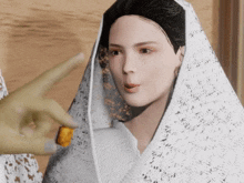 a woman with a white veil on her head looks at someone holding a piece of food