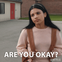 a woman with a backpack is asking if she is okay