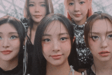 a group of young women are posing for a photo