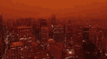 an aerial view of a city with a red background