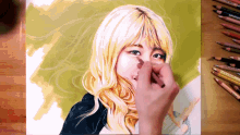 a person is drawing a woman with prismacolor colored pencils