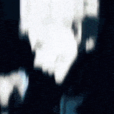 a blurry picture of a person 's face with a blue background