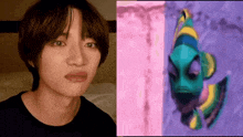 a close up of a person 's face next to a cartoon fish .