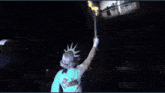 a person holding a microphone in a dark room with a shadow of a city on the wall