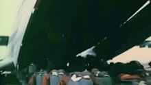 a group of people are standing in front of a large airplane