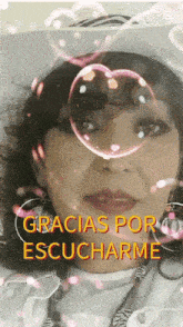 a woman with a heart shaped soap bubble in front of her face