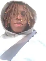 a man with dreadlocks wearing a grey hoodie