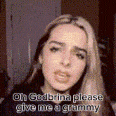 a woman is making a funny face and asking for a grammy .
