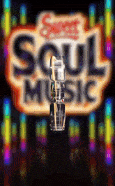 a sign that says soul music on it with a glass in front of it