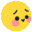 a blurred image of a yellow smiley face with pink cheeks and eyes .
