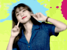 a blurry picture of a woman in a blue shirt