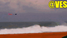an animated image of waves crashing on a beach with the words @ves above it