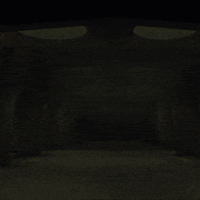 a woman is walking through a dark hallway with spotlights