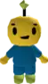 a yellow robot wearing a blue shirt and green pants with a green star on his head .