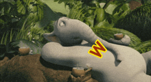 a cartoon elephant laying on its back with the letter w written on it