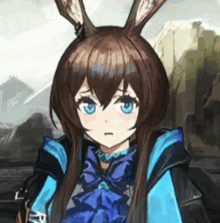 a girl with bunny ears and blue eyes is wearing a blue jacket .