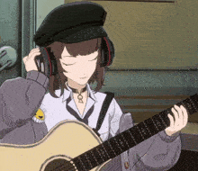 a girl wearing headphones and holding a guitar