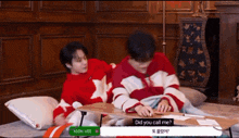 two boys are laying on a bed and one of them is asking the other " did you call me "