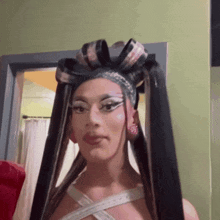 a woman with very long hair and a bow in her hair
