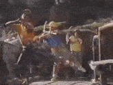 a group of construction workers are standing on a bridge carrying logs