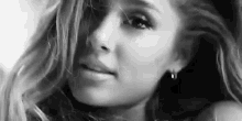 it is a black and white photo of a woman with long hair .