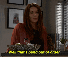 a woman standing in front of a bowl with the words well that 's bang out of order