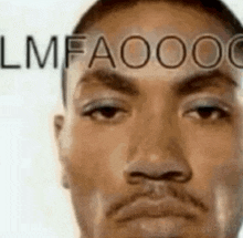 a close up of a man 's face with the word lmfaooo on his forehead .