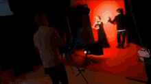 a blurry picture of a man standing in a room