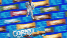 a man in a suit is standing in front of a box of corny big